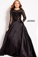 Model in Jovani 46066 elegant black gown with beaded sheer top.