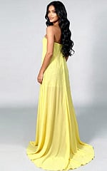 Fitted gown with bold sparkle details and dramatic cape