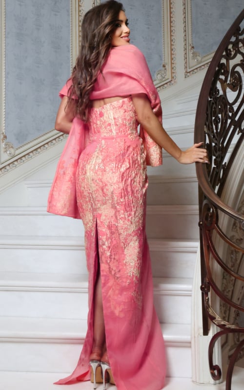 metallic textured gown with draped shawl and front slit, side view