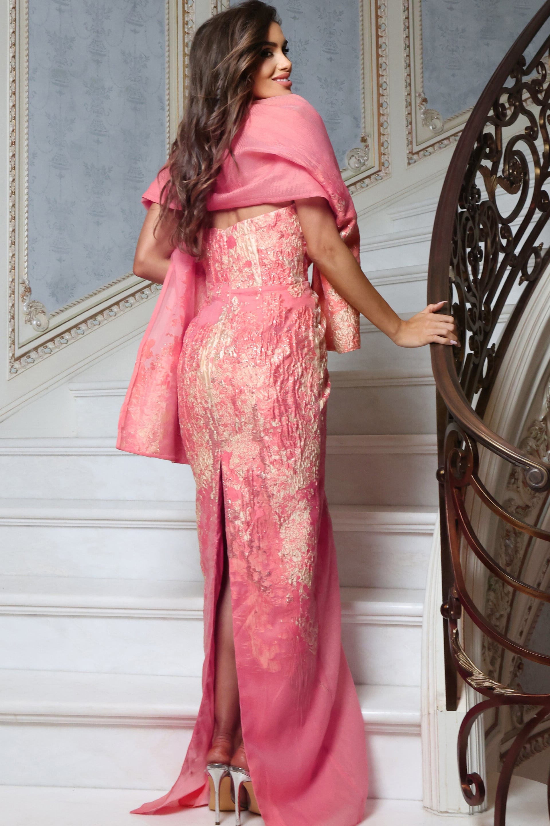 metallic textured gown with draped shawl and front slit, side view