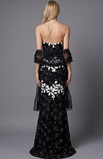 Back view of a strapless floral brocade column gown with fitted silhouette
