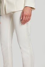 Detailed shot of blazer with crystal buttons and silver rhinestone necktie