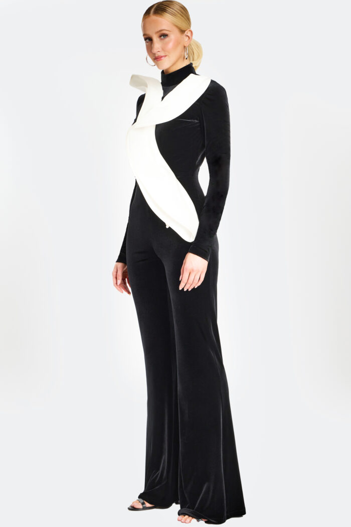 Three-quarter rear angle of black jumpsuit highlighting tailored fit