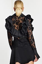 Back view of ruffled lace blouse with floral pattern and layered mini skirt