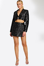 Model Wearing Black Textured Two-Piece Set with Cropped Blazer