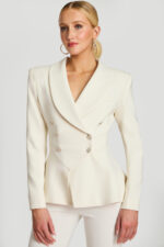 Front view of tailored off-white blazer with rhinestone buttons and wide shawl lapel