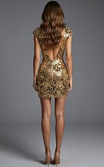 Back view of open back mini dress with gold mirror embellishment