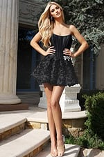 Strapless black corset dress with voluminous rosette skirt