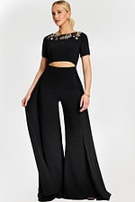 Black pantsuit with short sleeves, jeweled neckline, and front cutout