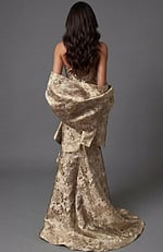 Back view of strapless formal gown with structured fit and flowing hem
