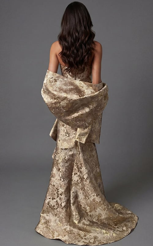 Back view of strapless formal gown with structured fit and flowing hem