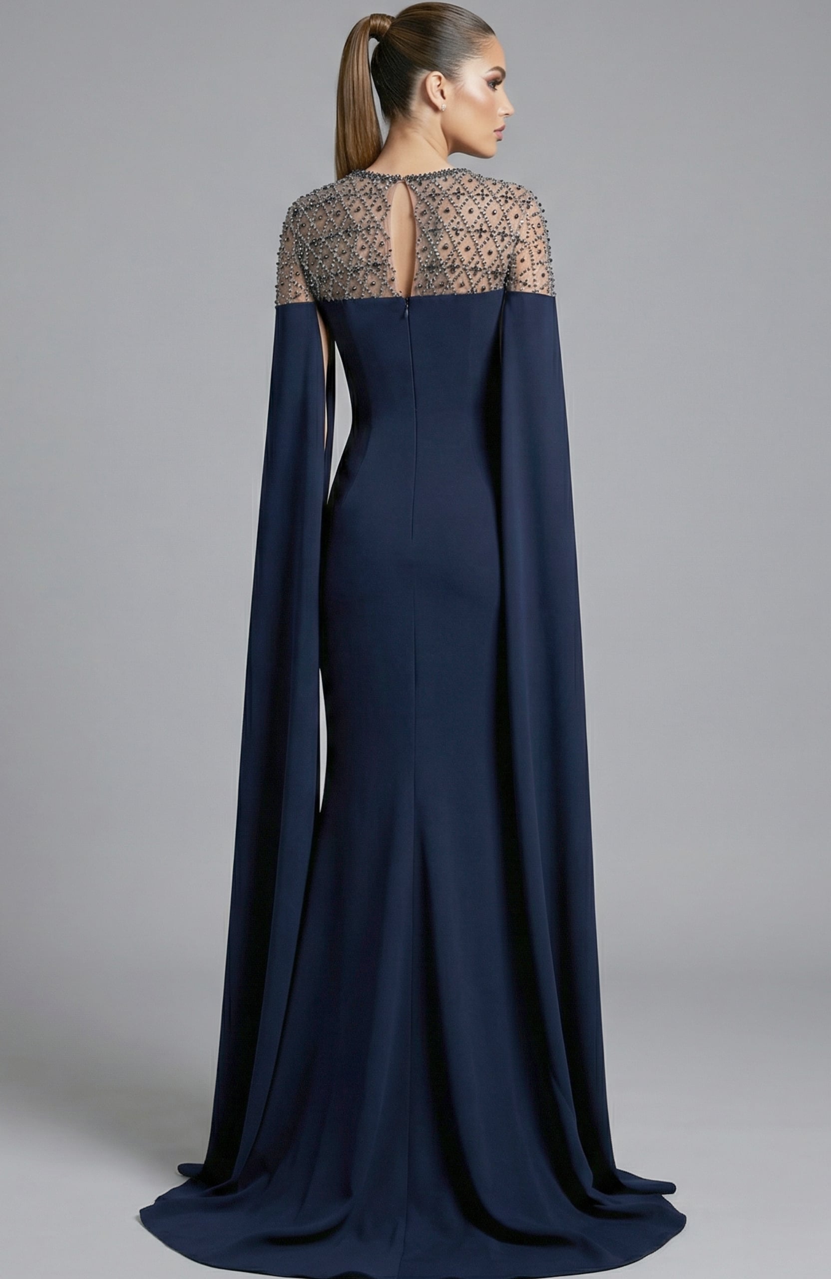 elegant gown with beaded illusion back and long draped sleeves