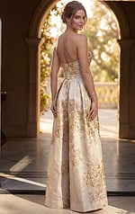 back view of ivory and gold floral brocade strapless A line gown with overskirt
