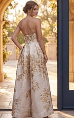 back view of ivory and gold floral brocade strapless A line gown with overskirt