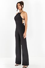 Side angle of sleeveless black jumpsuit with fitted bodice and open sides