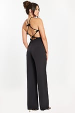 Back-side angle of open-back black jumpsuit with bow details