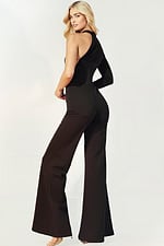 Elegant black jumpsuit featuring asymmetric neckline and flared legs