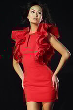 Sleeveless red mini dress with dramatic layered ruffles on shoulders