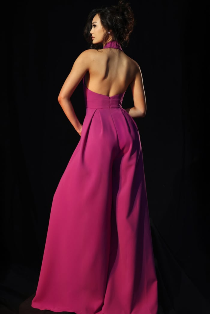 Stylish pink halter jumpsuit with deep neckline and side pockets