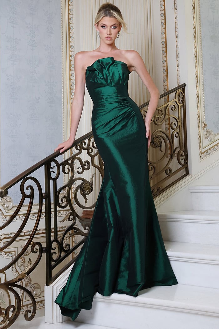 emerald strapless satin mermaid gown with pleated bodice - front full body, on stairs, updo, leaning