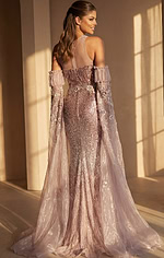 Designer embellished blush gown with dramatic sheer cape sleeves