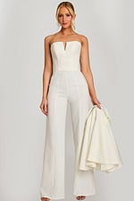 Strapless bridal jumpsuit back view with cape draped over shoulder