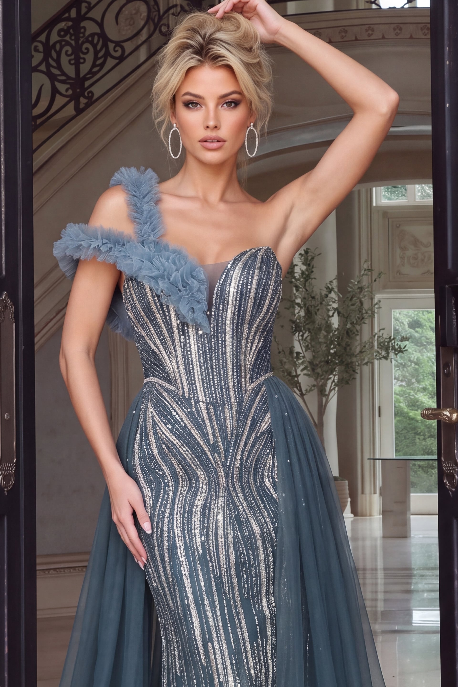 Close crop highlights swirling silver and gold beadwork across a corset bodice with tulle ruffle
