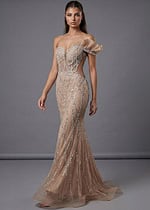 Asymmetrical beaded gown with sheer sculpted silhouette