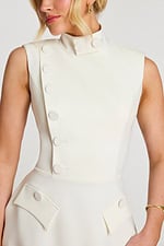 Close-up of structured bodice with button details and clean seams