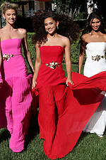 strapless black gown with gold floral waist detail - three girls front, smiling, flowing, strapless, gold belts