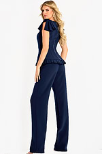 Navy blue jumpsuit with flutter sleeves and pleated peplum waist