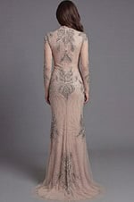 Couture nude gown with intricate crystal embroidery and long sleeves