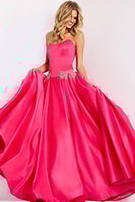 Hot pink strapless ball gown with crystal bow accents