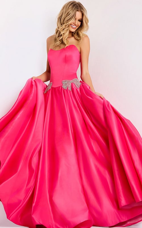 Hot pink strapless ball gown with crystal bow accents
