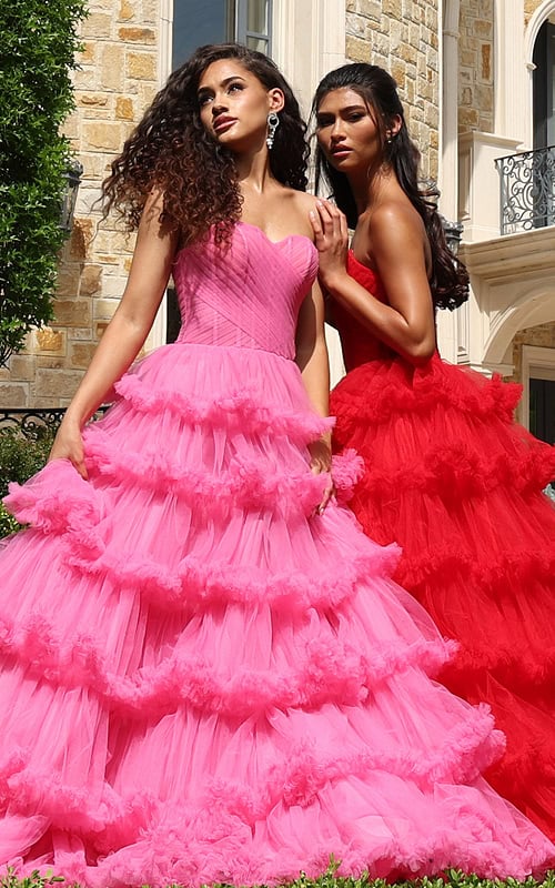 navy tiered tulle sweetheart slit prom dress - two girls front, curly hair looking up, hand on shoulder