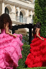 navy tiered tulle sweetheart slit prom dress - group back view, two contrasting dresses walking away