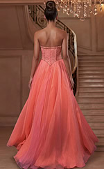 Back view of strapless tulle gown with structured corset and flowing train