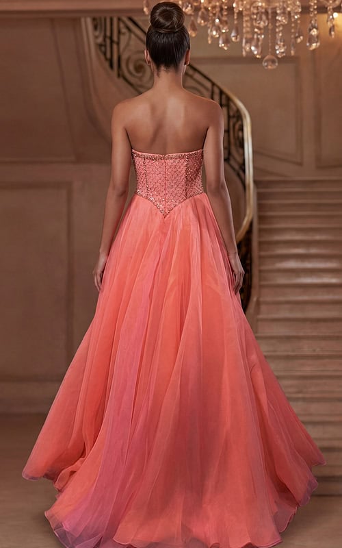 Back view of strapless tulle gown with structured corset and flowing train