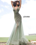 Model in Jovani 4741 green dress with a deep V-neckline and sequin design.