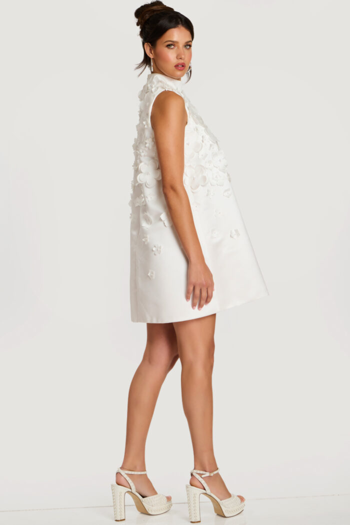Side profile of floral appliqué dress showing A-line silhouette