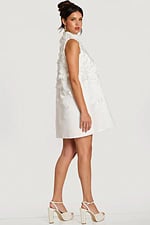 Side profile of floral appliqué dress showing A-line silhouette