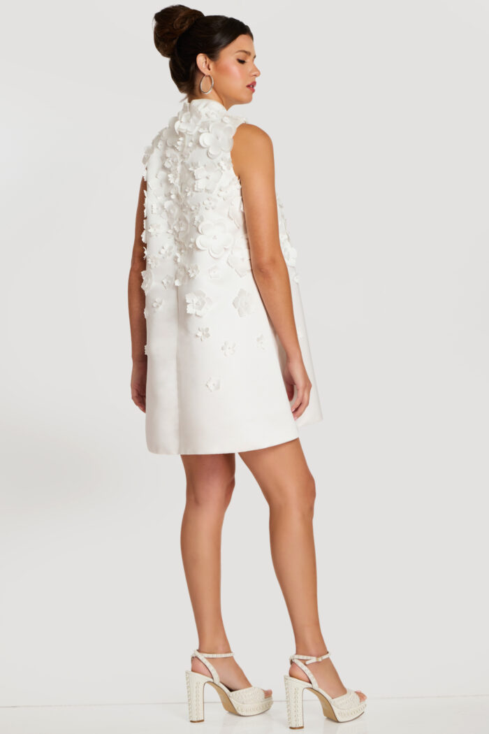 Three-quarter back view of 3D floral sleeveless dress with soft flare