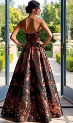 back view of black and copper floral brocade strapless ball gown