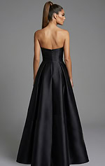 Back view of strapless full skirt ball gown with structured bodice