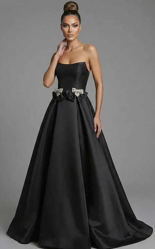 Front view of strapless ball gown with crystal bow waist details