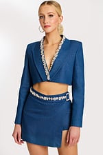 Denim crop blazer with embellished lapel and matching mini skirt featuring rhinestone belt buckle detailing.