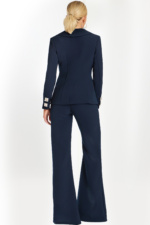 back view of Navy pantsuit with deep V-neck blazer, crystal square buttons, and embellished side bows.