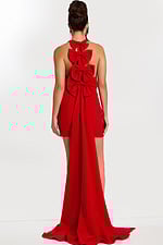 Back view of red halter dress featuring three large bows and long train