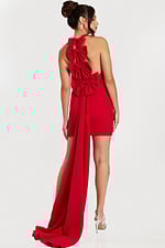 Side-back angle of red halter dress showcasing tiered bows and dramatic train