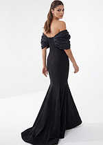 Alt: Black off-the-shoulder mermaid evening dress with statement puff sleeves and fitted bodice.